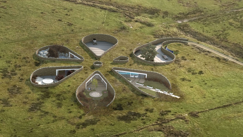 Illustration for article titled Look beneath the surface of these incredible underground homes